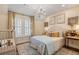 Charming bedroom with a queen-size bed and plenty of natural light at 6715 Berkley Rd, Cumming, GA 30040