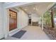 Covered patio with wood-burning stove and exterior door at 6715 Berkley Rd, Cumming, GA 30040