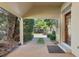 Covered patio entrance with gravel flooring and wooden door at 6715 Berkley Rd, Cumming, GA 30040