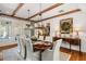 Elegant dining room features hardwood floors, chandelier, and built-in cabinetry at 6715 Berkley Rd, Cumming, GA 30040