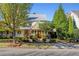 Charming house with metal roof, and professionally landscaped front yard at 6715 Berkley Rd, Cumming, GA 30040