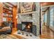 Stunning stone fireplace with detailed mantel and hearth at 6715 Berkley Rd, Cumming, GA 30040