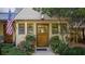 Inviting front entrance with a classic wooden door and landscaping at 6715 Berkley Rd, Cumming, GA 30040