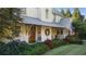 Inviting front porch with rocking chairs and a porch swing at 6715 Berkley Rd, Cumming, GA 30040