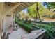 Serene front porch with swing and rocking chair, neighborhood view at 6715 Berkley Rd, Cumming, GA 30040