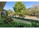 Neatly landscaped front yard with green lawn and boxwood hedges at 6715 Berkley Rd, Cumming, GA 30040