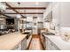 Open kitchen with farmhouse sink, stainless steel appliances, and hardwood floors at 6715 Berkley Rd, Cumming, GA 30040