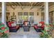 Covered patio featuring comfortable seating, a fire pit, and ceiling fan at 6715 Berkley Rd, Cumming, GA 30040