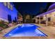 Blue-lit pool at night, offering a serene and tranquil ambiance at 6715 Berkley Rd, Cumming, GA 30040