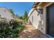 Charming side yard with gravel pathway and lush landscaping at 6715 Berkley Rd, Cumming, GA 30040