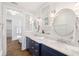 Elegant bathroom with double vanity, marble countertops, and a view into a large soaking tub at 6830 Vickery Creek Rd, Cumming, GA 30040