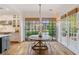 Bright breakfast nook with a round table and large windows at 6830 Vickery Creek Rd, Cumming, GA 30040