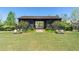 Large black community barn with open sides and green space at 6830 Vickery Creek Rd, Cumming, GA 30040