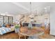 Open concept dining area with kitchen views and wood table at 6830 Vickery Creek Rd, Cumming, GA 30040