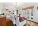 Formal dining room with hardwood floors and French doors at 6830 Vickery Creek Rd, Cumming, GA 30040