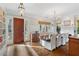 Elegant dining room with a large table, stylish lighting, and a view of the fireplace at 6830 Vickery Creek Rd, Cumming, GA 30040