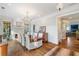 Elegant dining room featuring a large table, chandelier, and hardwood floors at 6830 Vickery Creek Rd, Cumming, GA 30040