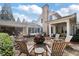 Fire pit surrounded by wooden chairs in a backyard setting at 6830 Vickery Creek Rd, Cumming, GA 30040