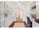 Hallway features desk area with stylish white built-ins and abundant natural light at 6830 Vickery Creek Rd, Cumming, GA 30040