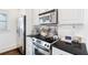 Well-equipped kitchen, featuring stainless steel appliances and granite countertops at 6830 Vickery Creek Rd, Cumming, GA 30040