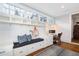 Laundry room with built-in bench, storage and hardwood floors at 6830 Vickery Creek Rd, Cumming, GA 30040