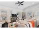 Inviting living room with a ceiling fan, comfortable seating, a TV, and large windows for natural light at 6830 Vickery Creek Rd, Cumming, GA 30040