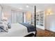 Main bedroom with built-in shelving and hardwood floors at 6830 Vickery Creek Rd, Cumming, GA 30040