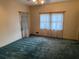 Bedroom with a large window and curtains at 1200 Lakewood Ne Dr, Conyers, GA 30013