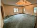 Large bedroom with natural lighting, tray ceilings, and ceiling fan at 1200 Lakewood Ne Dr, Conyers, GA 30013