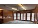 Bright living room with wood cabinets, paneled walls, and lots of natural light at 1200 Lakewood Ne Dr, Conyers, GA 30013