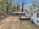 Spacious backyard featuring a large deck, storage shed, and fenced-in area at 4760 Hillside Dr, Acworth, GA 30101