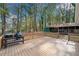 Large wooden deck in fenced backyard with outdoor kitchen area at 4760 Hillside Dr, Acworth, GA 30101