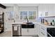 Bright kitchen featuring white subway tile, modern appliances and butcher block countertops at 4760 Hillside Dr, Acworth, GA 30101