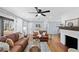 Bright living room features a brick fireplace and hardwood floors at 4760 Hillside Dr, Acworth, GA 30101