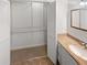 Bathroom with spacious closet, granite countertops, large mirror and modern fixtures at 2007 Variations Ne Dr, Atlanta, GA 30329