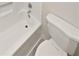 Close-up of a clean white bathtub and toilet in a bright, simple bathroom at 2007 Variations Ne Dr, Atlanta, GA 30329