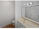 Bathroom featuring a large mirror, neutral countertops, and tile flooring at 2007 Variations Ne Dr, Atlanta, GA 30329