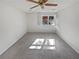 Bright bedroom with a ceiling fan, neutral carpet and a window with natural light at 2007 Variations Ne Dr, Atlanta, GA 30329