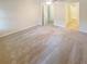 Bedroom featuring neutral carpet and views to an adjoined bathroom and hallway at 2007 Variations Ne Dr, Atlanta, GA 30329