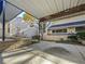 Spacious carport area with a concrete surface and a view of the surrounding garden and home at 2007 Variations Ne Dr, Atlanta, GA 30329