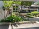 Charming home exterior with lush landscaping and covered parking area, enhancing curb appeal at 2007 Variations Ne Dr, Atlanta, GA 30329