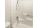 Shower with white walls, modern fixtures, and a convenient built-in soap shelf at 2007 Variations Ne Dr, Atlanta, GA 30329
