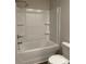 Bright bathroom featuring a white tub and shower combination with built-in shelving at 107 Meadowview Dr # 23, Temple, GA 30179