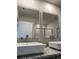 Bathroom features double sinks, a granite countertop, and modern LED-lit mirrors creating a luxurious retreat at 107 Meadowview Dr # 23, Temple, GA 30179