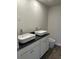 Modern bathroom featuring double sinks, a dark countertop, and contemporary fixtures for a spa-like experience at 107 Meadowview Dr # 23, Temple, GA 30179