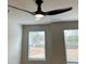 Neutral bedroom featuring a modern ceiling fan and two windows at 107 Meadowview Dr # 23, Temple, GA 30179