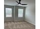 Neutral bedroom featuring two windows letting in lots of natural light at 107 Meadowview Dr # 23, Temple, GA 30179