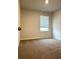 Neutral bedroom featuring a window letting in lots of natural light at 107 Meadowview Dr # 23, Temple, GA 30179
