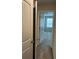 Hallway with view into bedroom and a partially open closet at 107 Meadowview Dr # 23, Temple, GA 30179