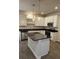 Modern kitchen features stainless steel appliances, sleek cabinets, and a dark countertop island at 107 Meadowview Dr # 23, Temple, GA 30179